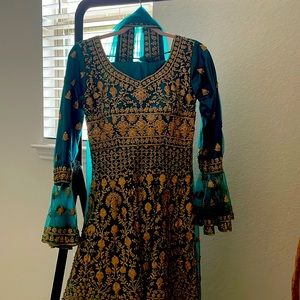 A beautiful teal ghara pants set with a high-low top.